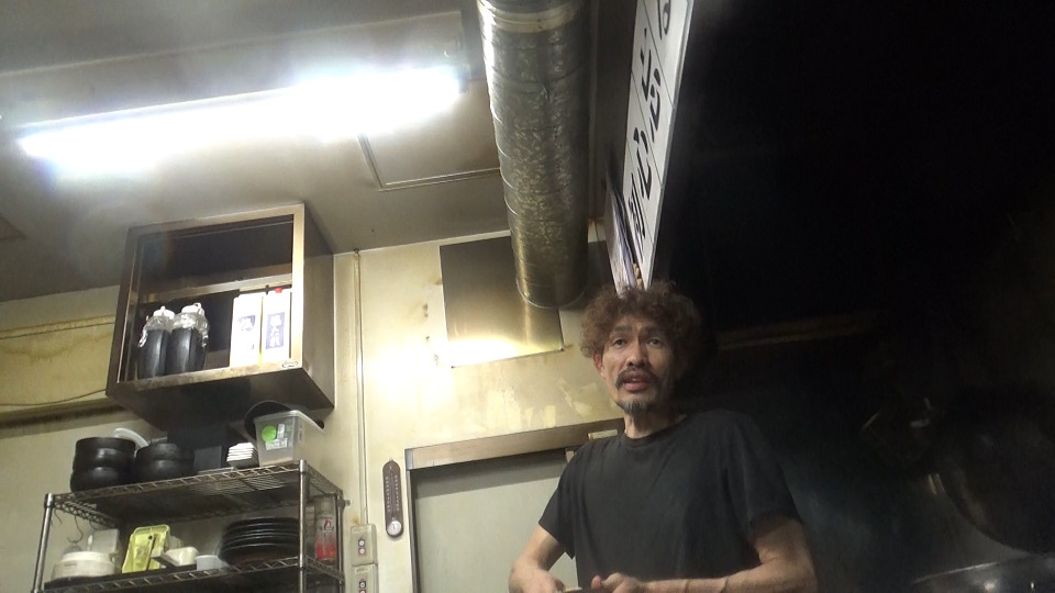 店主の小池信也さんの写真